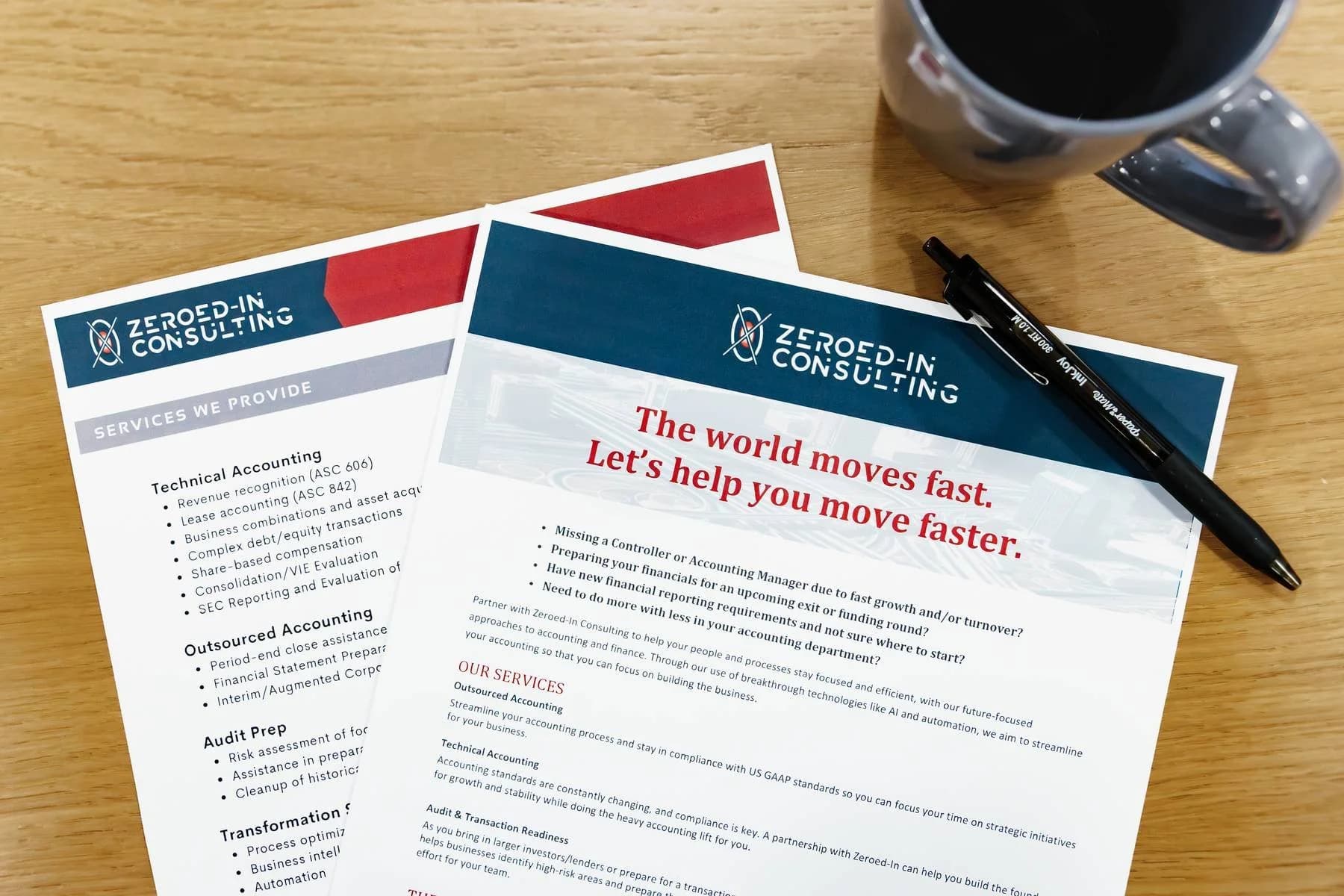 Zeroed-In Consulting brochures on financial services next to a cup of coffee